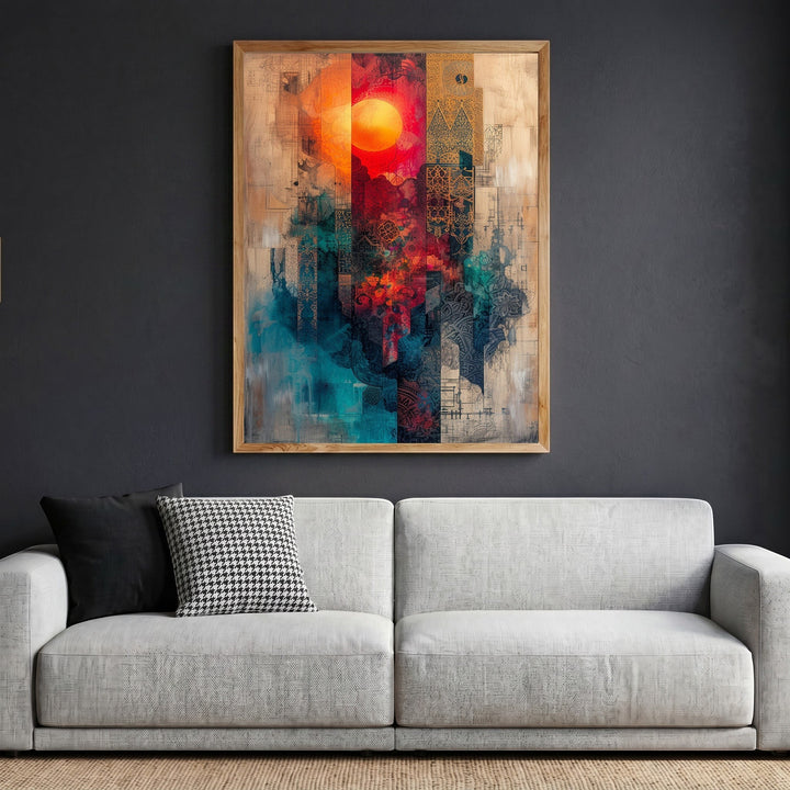 Wadi Home abstract geometric framed canvas wall art with a sun motif in red and teal tones above a modern sofa.