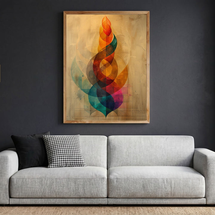 Wadi Home abstract geometric framed wall art with vibrant spiraling colors hanging above a modern grey sofa.