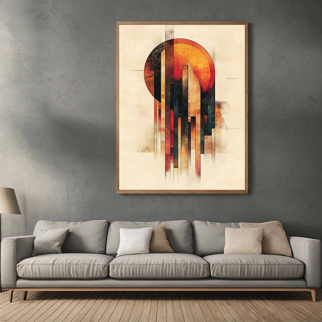 Wadi Home abstract geometric sun wall art print in a wooden frame hanging above a modern grey sofa in a living room.