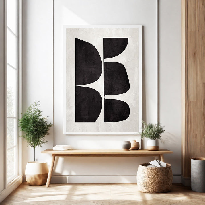 Wadi Home abstract geometric wall art with black organic shapes on textured off-white background.