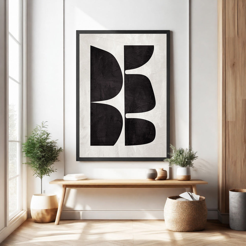 Wadi Home abstract geometric wall art with black organic shapes on textured off-white background.