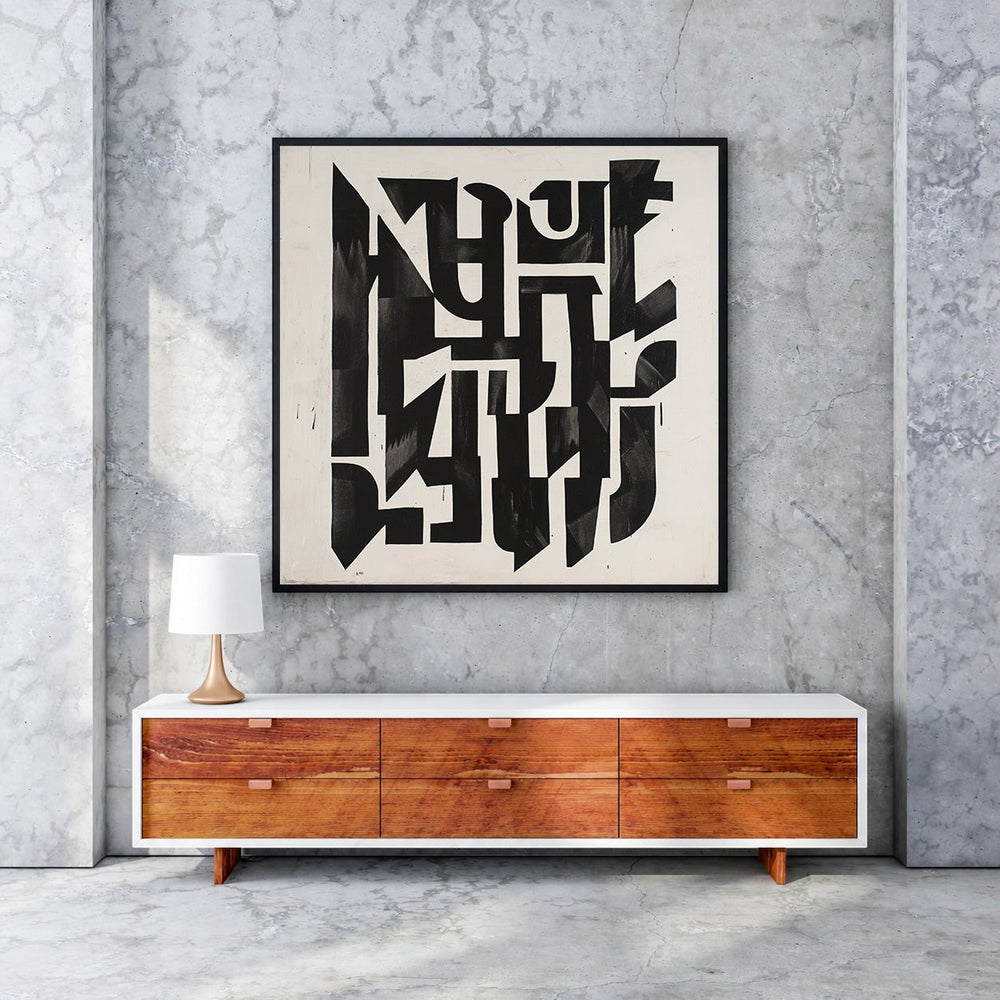 Wadi Home abstract monochrome geometric wall art with bold shapes and sharp lines on a cream background, framed in black.