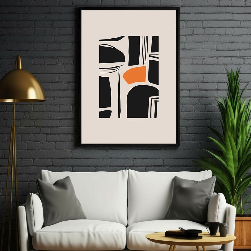 Wadi Home abstract geometric wall art with black shapes and orange accent on a cream background, framed in black.