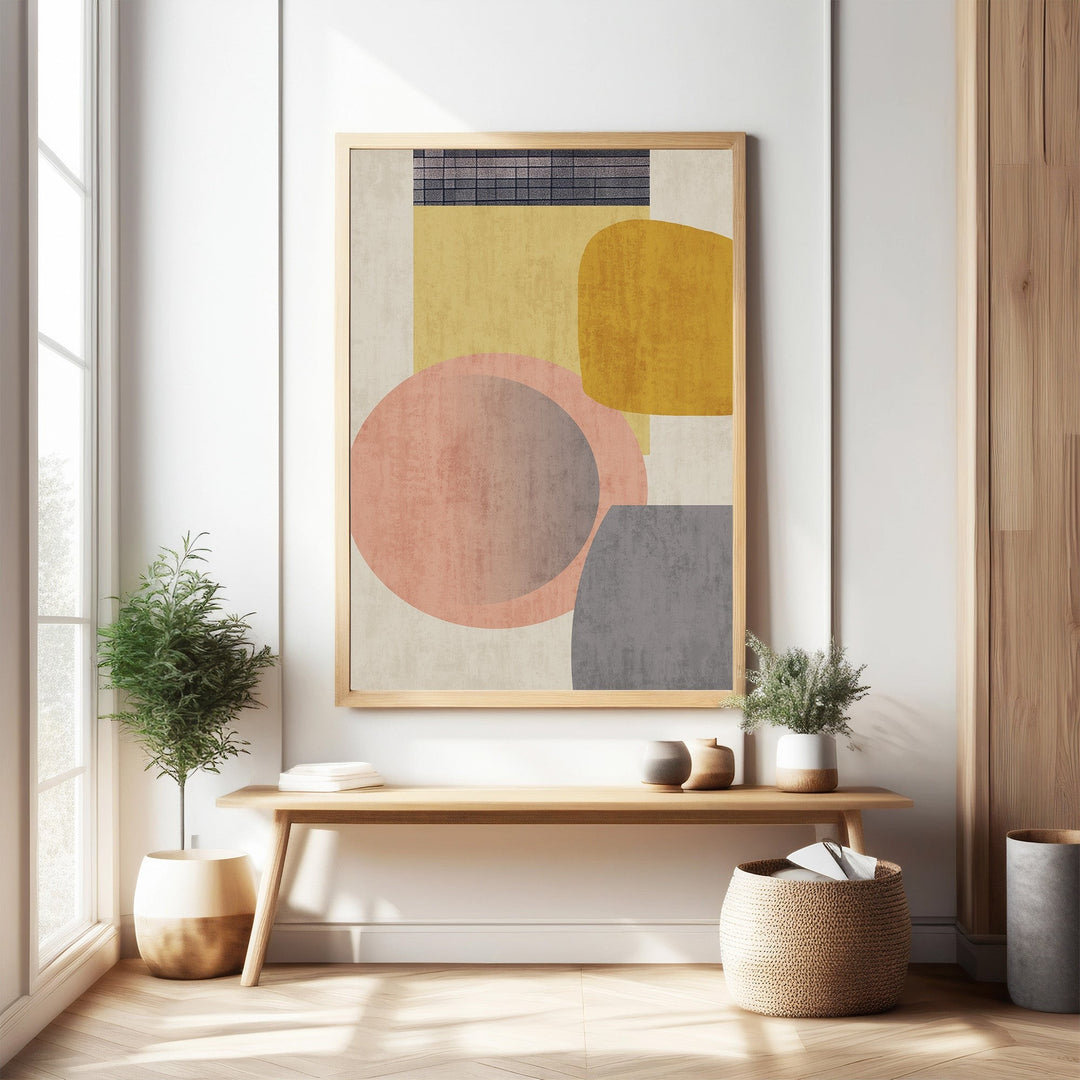 Wadi Home abstract geometric wall art with blush pink, mustard yellow, and grey circles and rectangles.