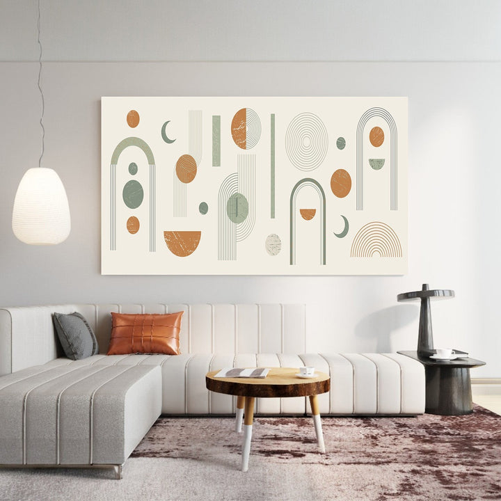 Wadi Home large abstract geometric wall art with sage green, terracotta, and cream shapes above a modern sofa.