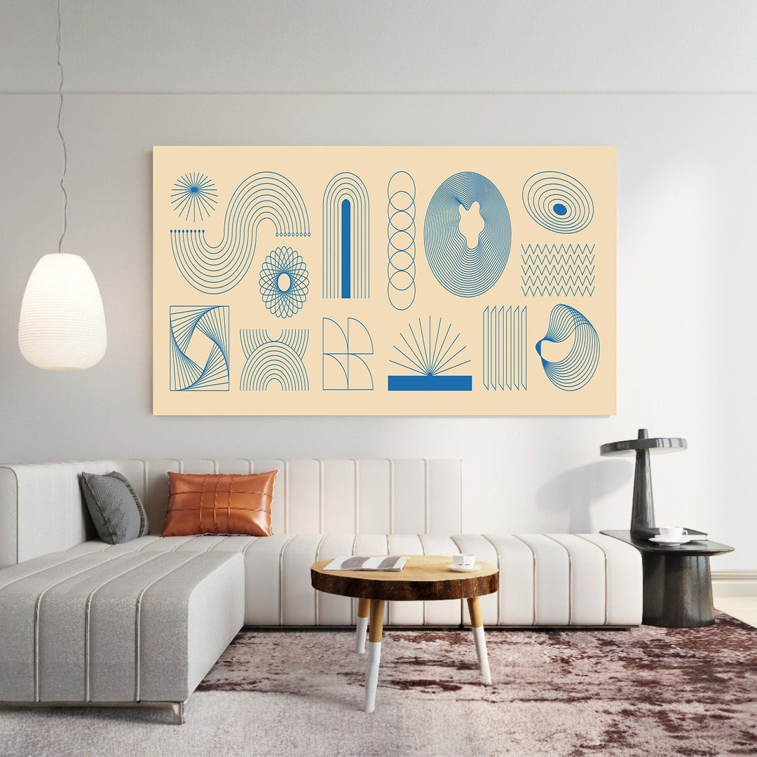 Wadi Home abstract geometric line art print with blue motifs on a cream background displayed above a modern sofa.
