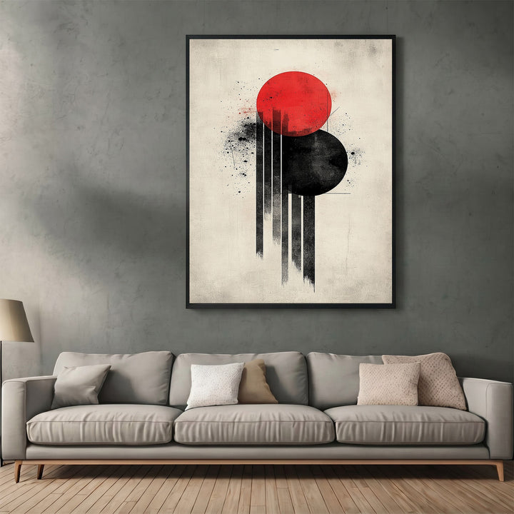 Wadi Home abstract geometric wall art print with red and black circles on an off-white background above a sofa.