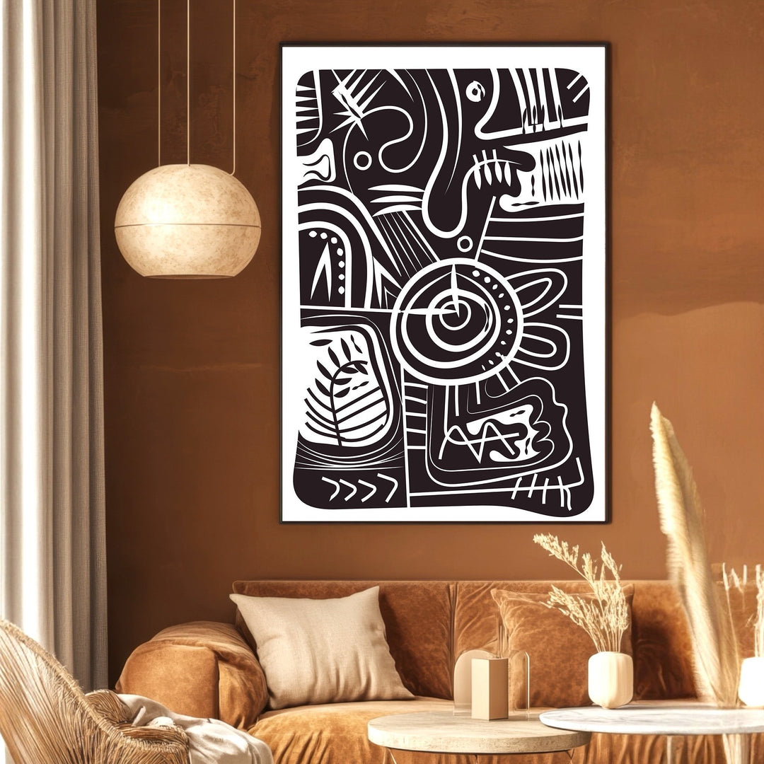 Wadi Home abstract geometric wall art print in black and white hanging above a modern brown velvet sofa in a living room