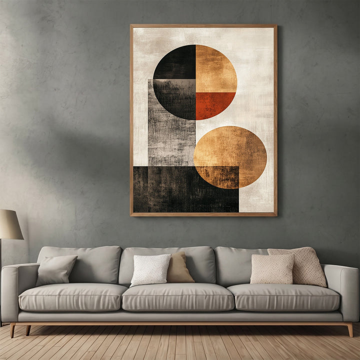 Wadi Home abstract geometric wall art print featuring circles in black, ochre, and burnt orange above a grey sofa.
