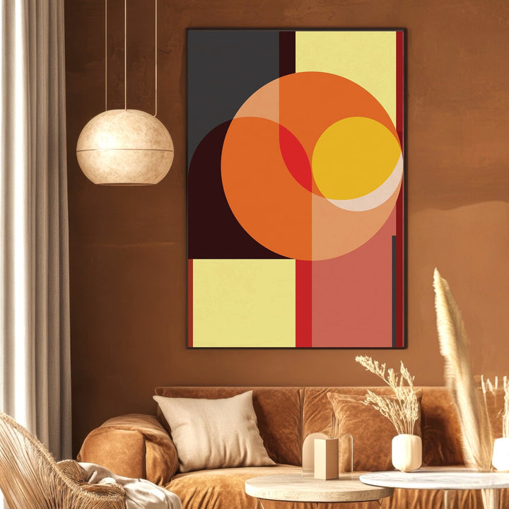 Wadi Home abstract geometric wall art print with orange, charcoal, and yellow shapes in a modern living room setting.