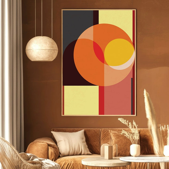 Wadi Home abstract geometric wall art print with orange, charcoal, and yellow shapes in a modern living room.