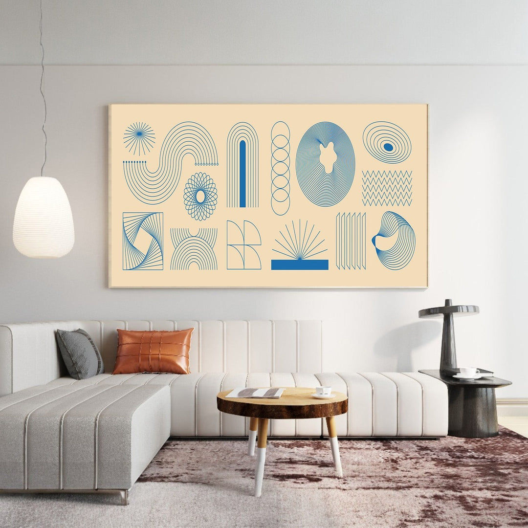 Wadi Home abstract geometric line art print with blue motifs on a cream background displayed above a modern sofa.