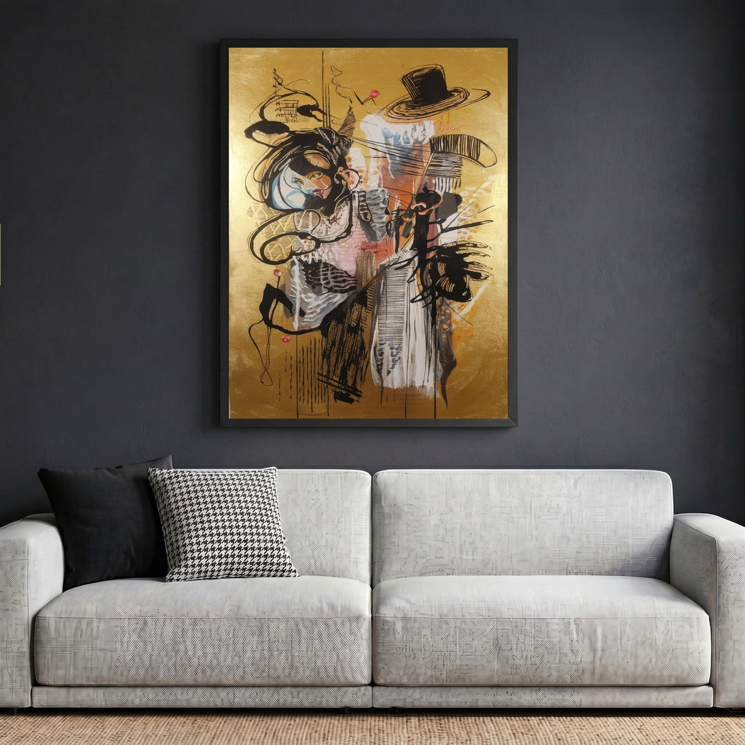 Wadi Home abstract expressionist framed wall art with gold background and black gestural lines above a grey sofa.