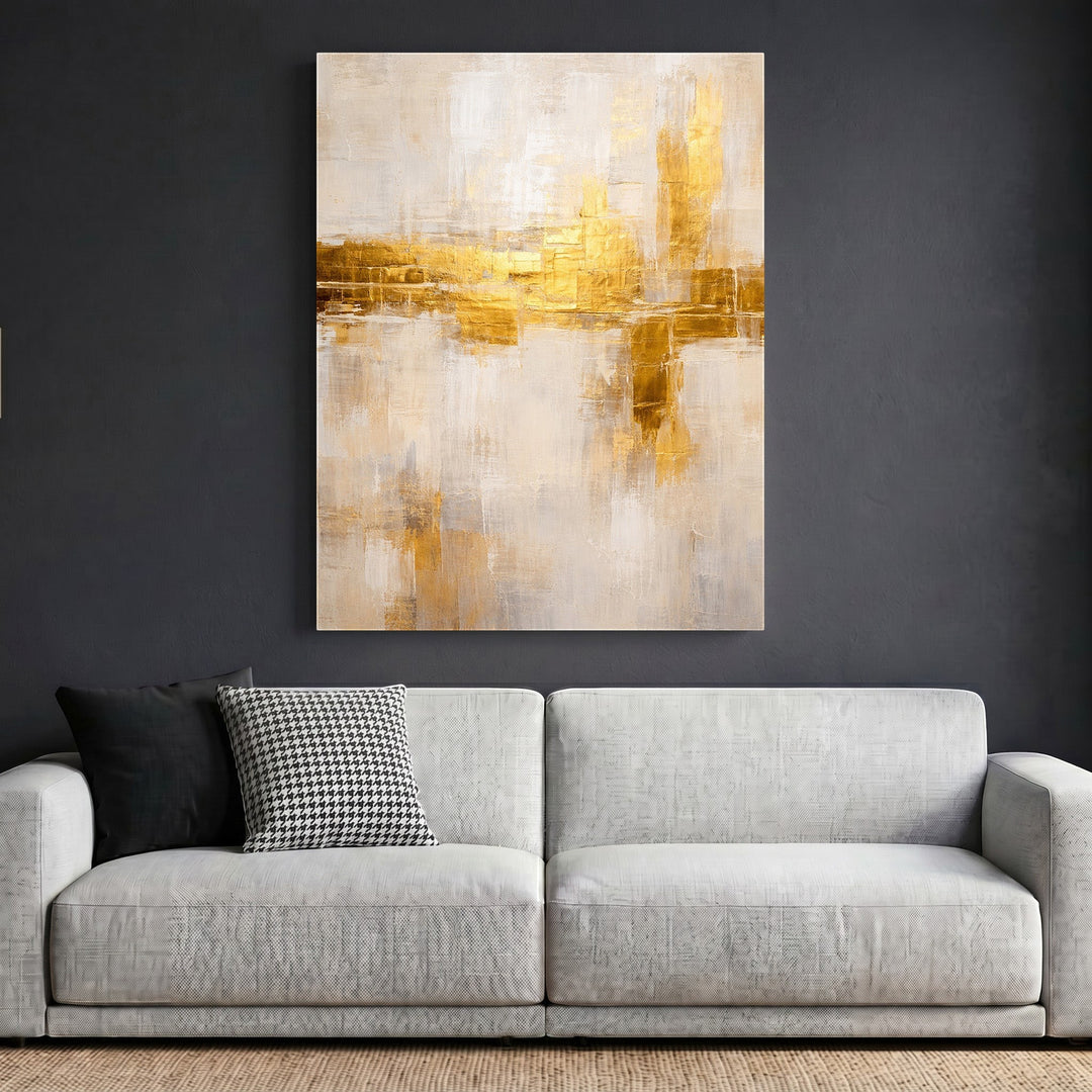 Wadi Home abstract textured canvas wall art with neutral tones and shimmering gold accents hanging above a modern sofa.