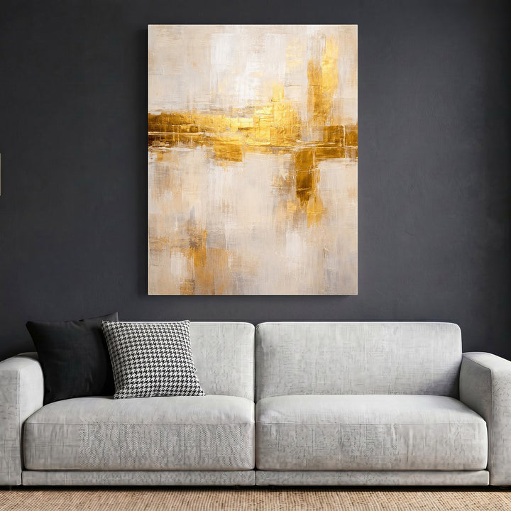 Wadi Home abstract textured canvas wall art with neutral tones and shimmering gold accents hanging above a modern sofa.