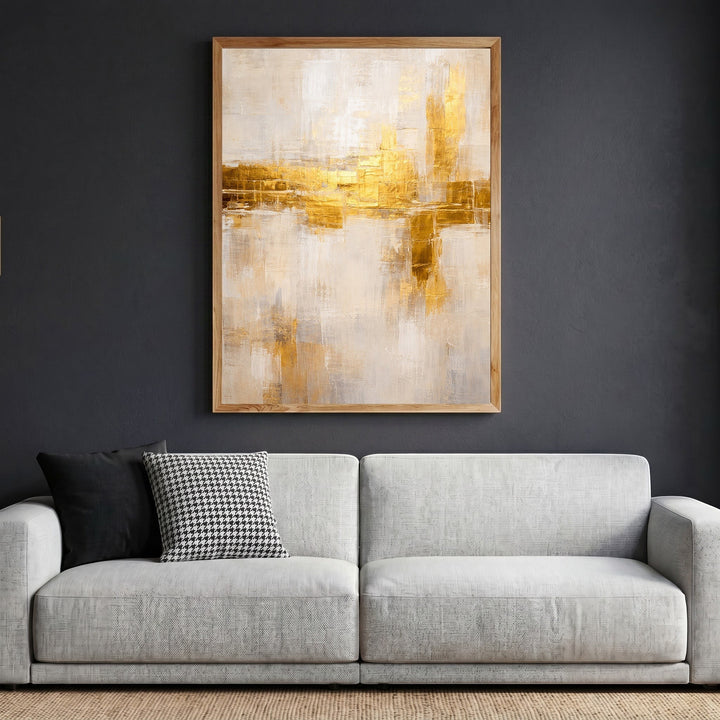 Wadi Home abstract textured canvas wall art with gold accents in a wooden frame above a modern grey sofa.