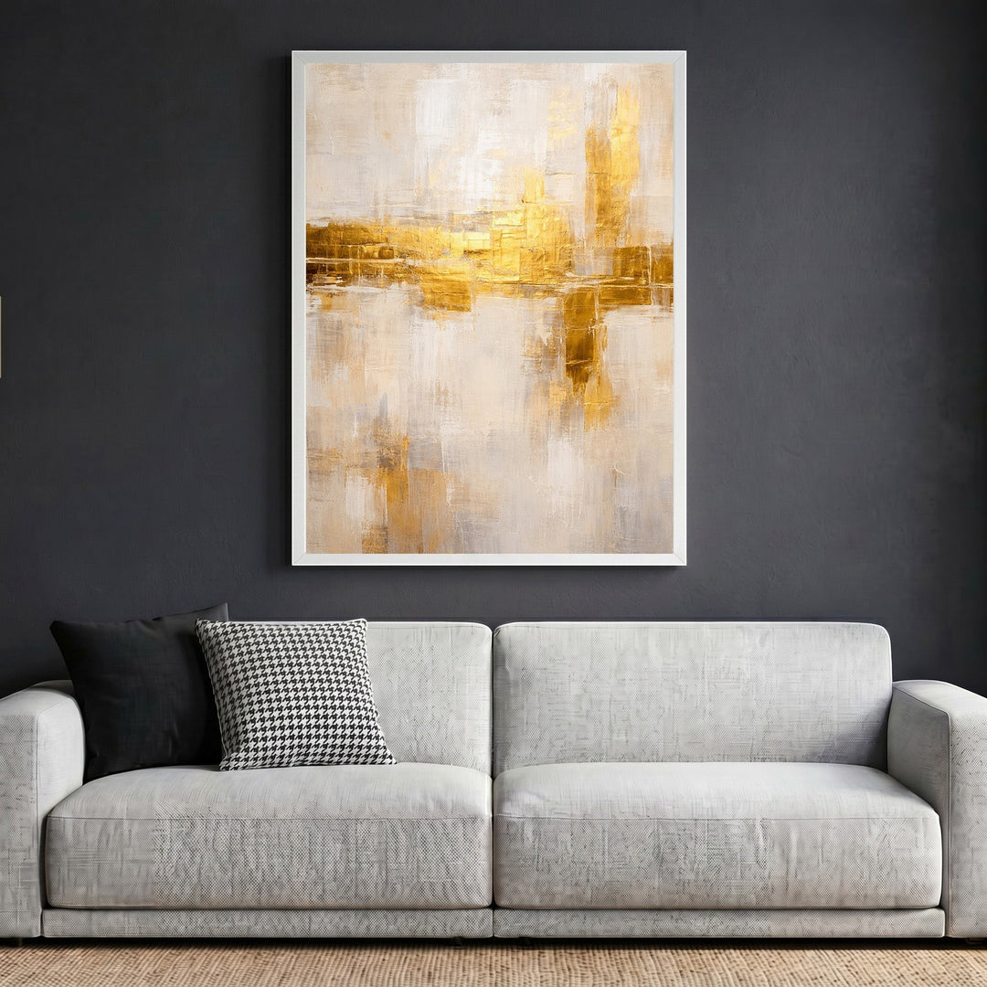 Wadi Home abstract textured canvas wall art with gold accents and neutral tones in a white frame above a sofa.