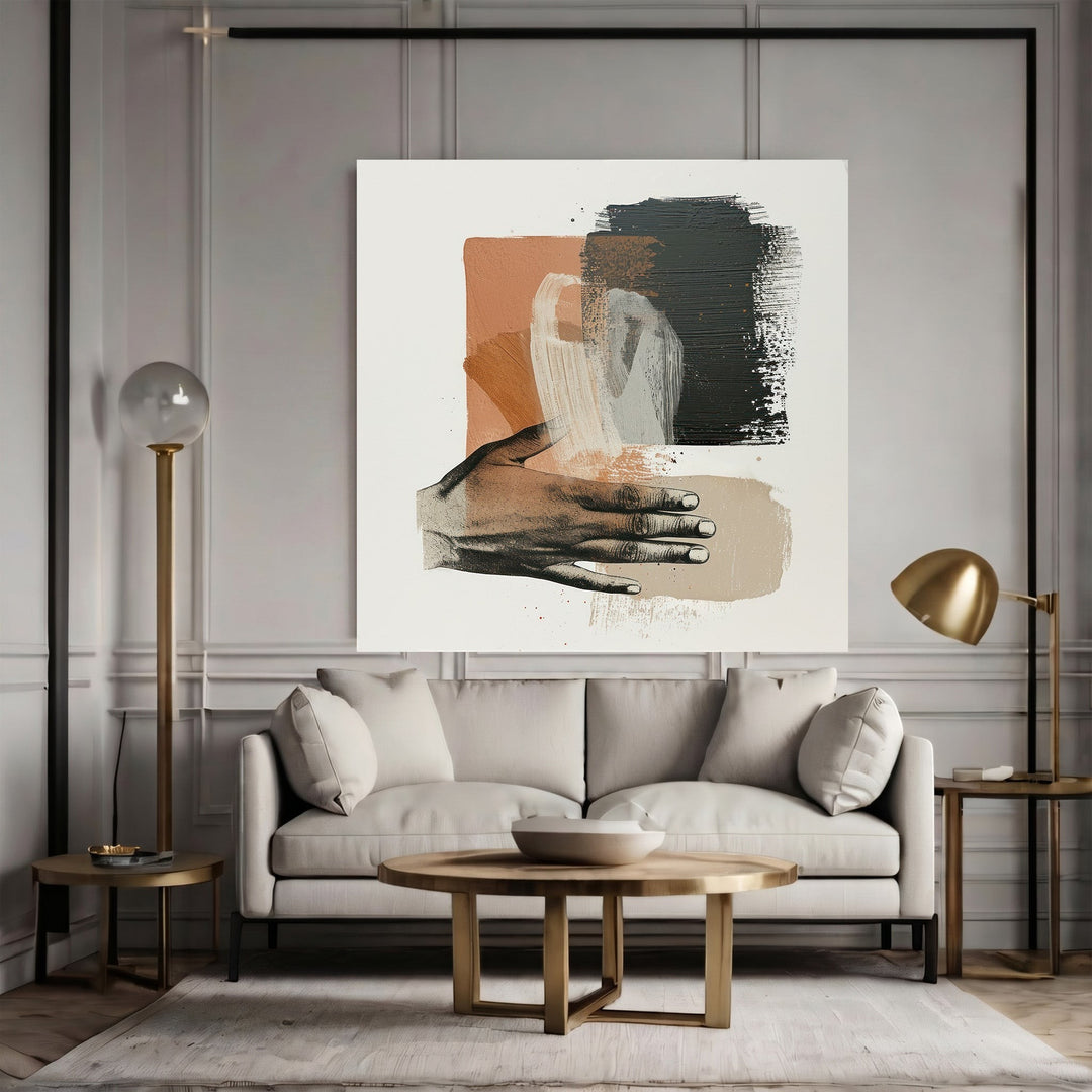 Wadi Home abstract hand illustration framed wall art with terracotta, charcoal, and cream brushstrokes above a sofa.
