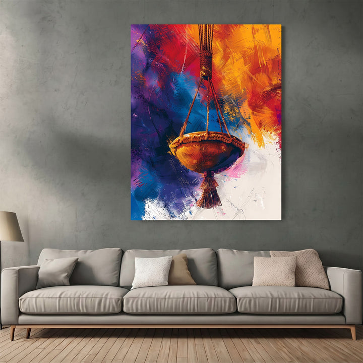 Wadi Home abstract hanging basket wall art print with vibrant orange, gold, purple, and blue brushstrokes above a sofa.