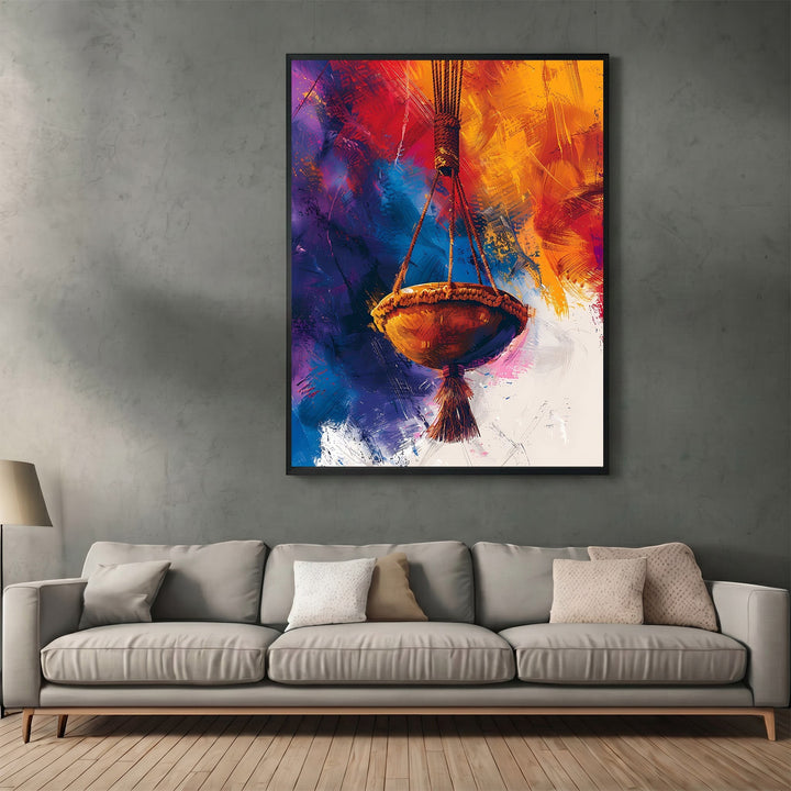 Wadi Home abstract hanging basket wall art print with vibrant orange, purple, and gold brushstrokes above a sofa.
