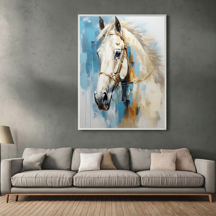 Wadi Home abstract horse portrait canvas print with cream and blue brushstrokes hanging above a modern grey sofa.