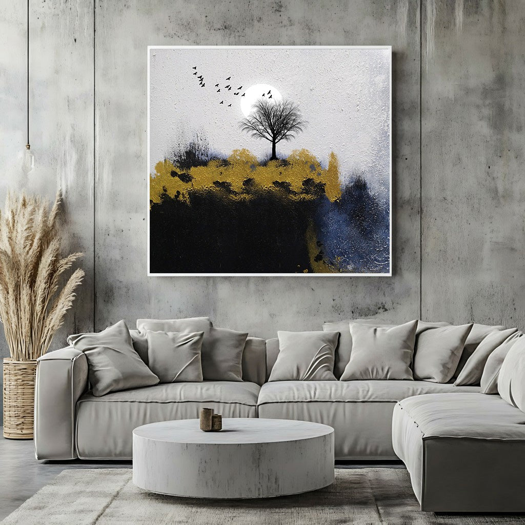Wadi Home abstract landscape canvas art featuring a lone tree, moon, and gold accents hanging above a modern sofa.