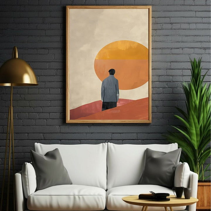 Wadi Home abstract landscape wall art with a lone figure in a blue jacket facing a large orange sun. Earthy tones of orange, red, and cream.