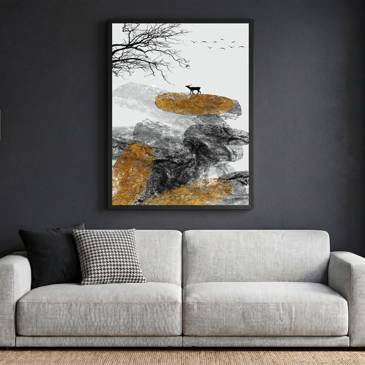 Wadi Home abstract landscape wall art featuring a deer, textured rocks, and gold accents above a modern grey sofa.