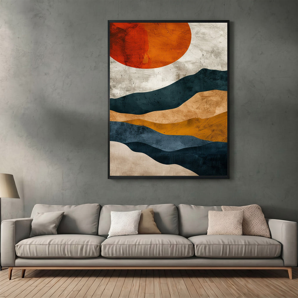 Wadi Home abstract landscape wall art print featuring navy, ochre, and burnt orange sun above a modern grey sofa.