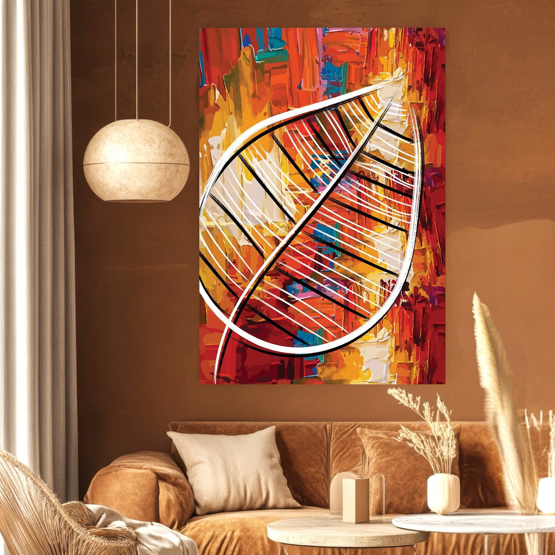 Wadi Home abstract leaf canvas print with vibrant red, orange, and yellow textures hanging in a modern living room.