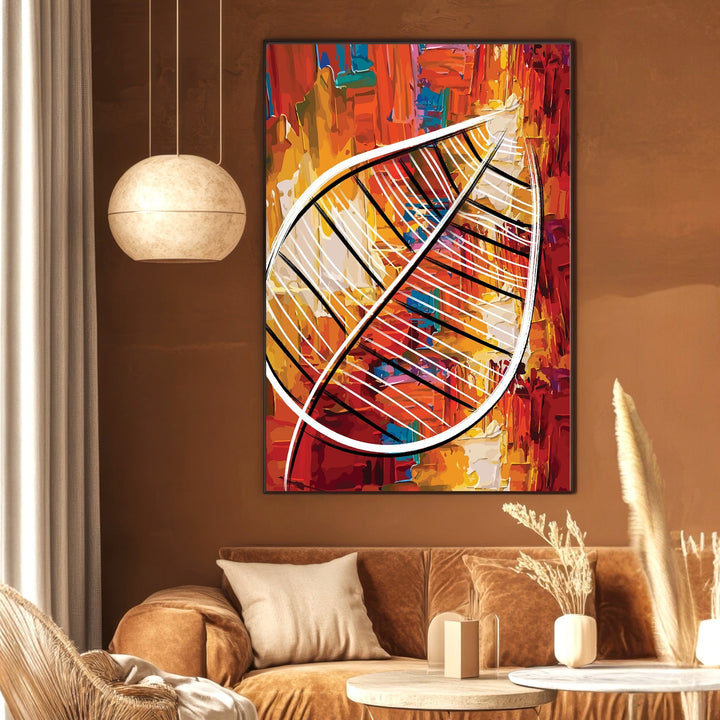 Wadi Home abstract leaf canvas print with textured red, orange, and yellow paint strokes hanging in a modern living room