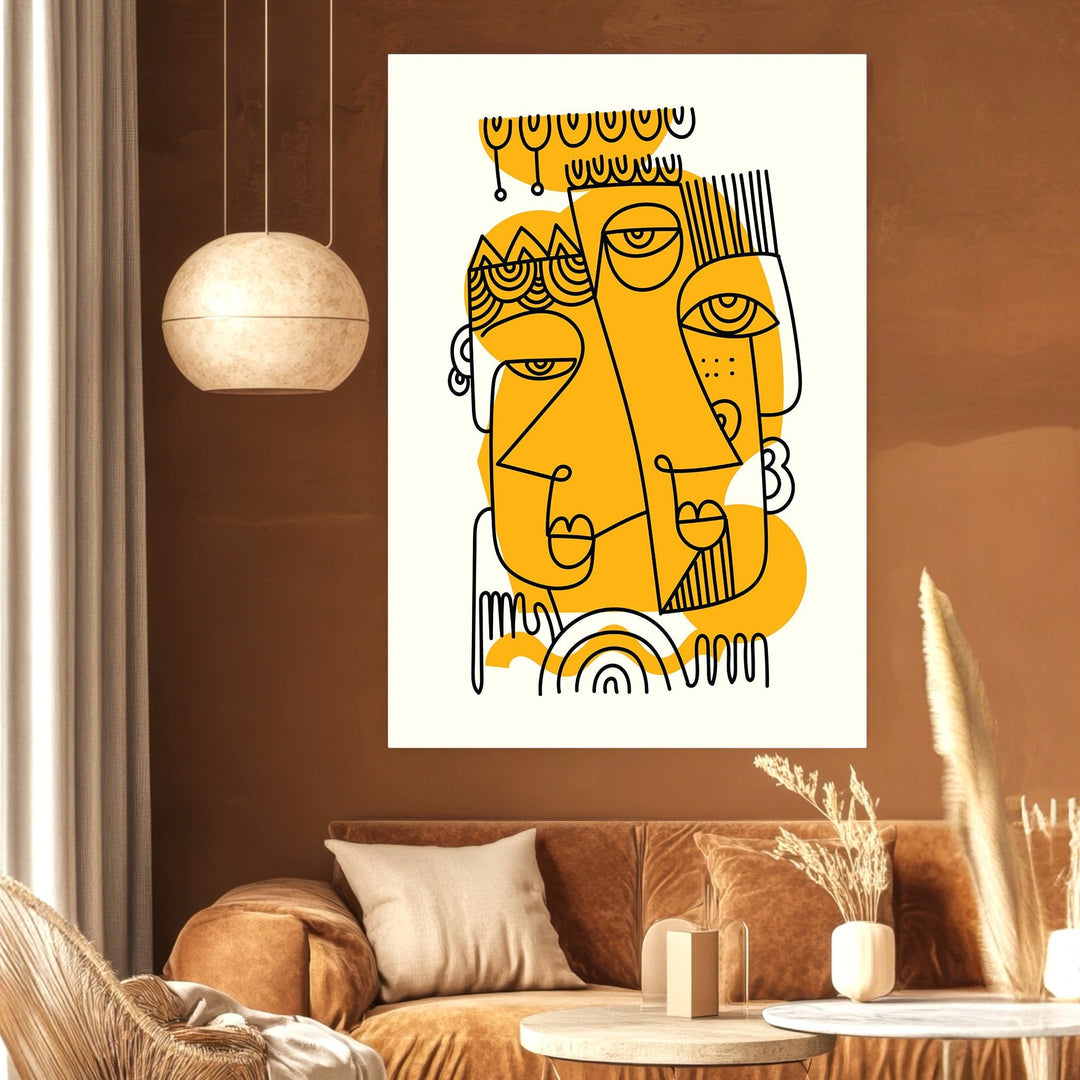 Wadi Home abstract line art wall print featuring black faces and mustard yellow accents in a modern living room.
