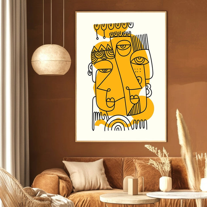 Wadi Home abstract line art print featuring black faces on mustard yellow accents, displayed in a modern living room.