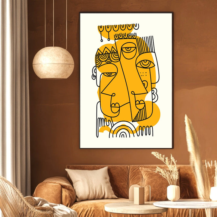 Wadi Home abstract line art wall print featuring black faces on mustard yellow accents in a modern living room.