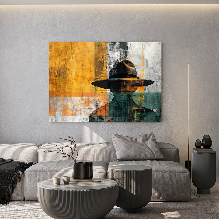 Wadi Home abstract man with hat wall art, featuring a silhouette in warm yellows, teals, and grays.