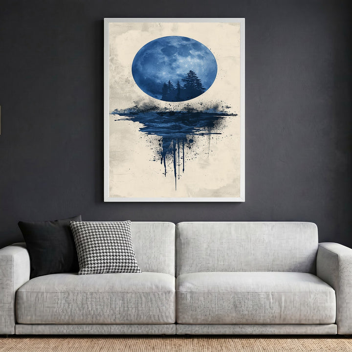 Wadi Home abstract moon landscape framed wall art featuring a blue moon over a forest silhouette above a grey sofa.