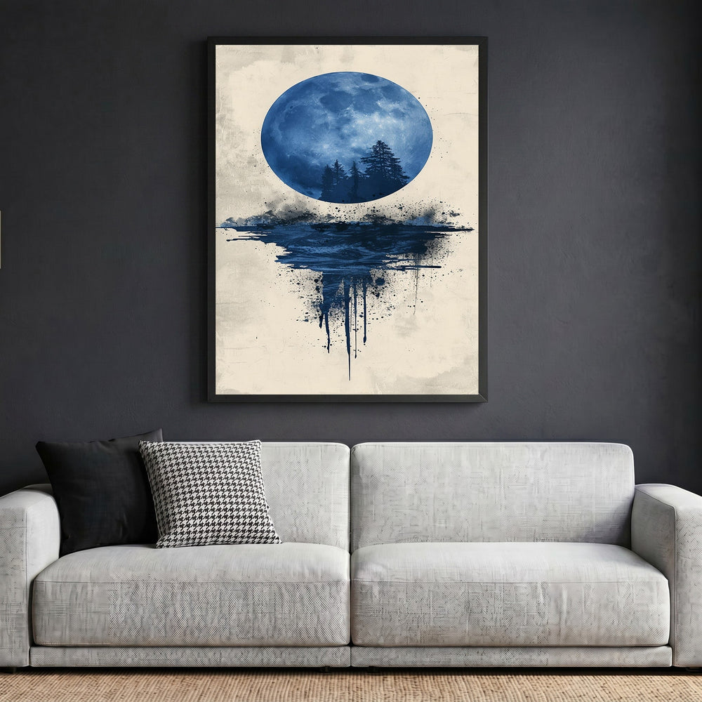 Wadi Home abstract moon landscape wall art print with blue moon and forest silhouette in a black frame above a sofa.