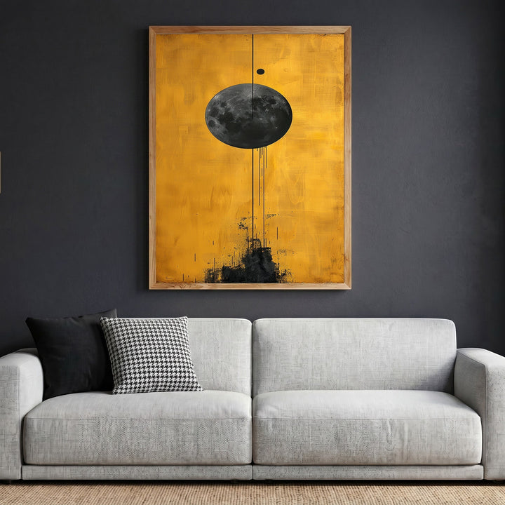 Wadi Home abstract celestial moon wall art print with a textured black lunar sphere on a vibrant golden yellow background