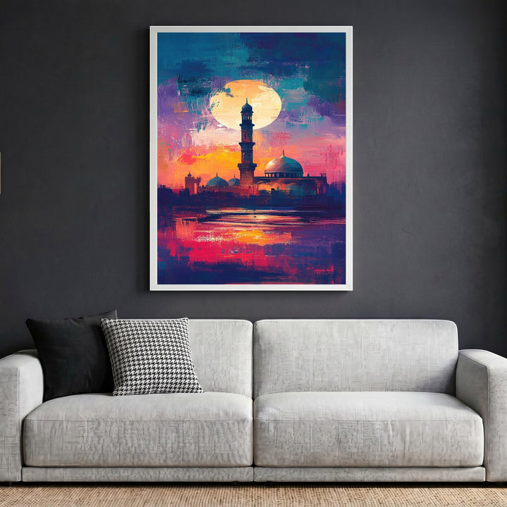 Wadi Home abstract mosque landscape framed wall art with vibrant sunset colors hanging above a modern grey sofa.