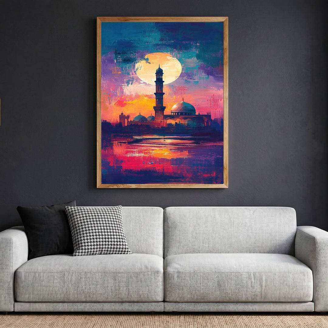 Wadi Home abstract mosque landscape wall art with vibrant sunset colors in a wooden frame above a modern grey sofa.