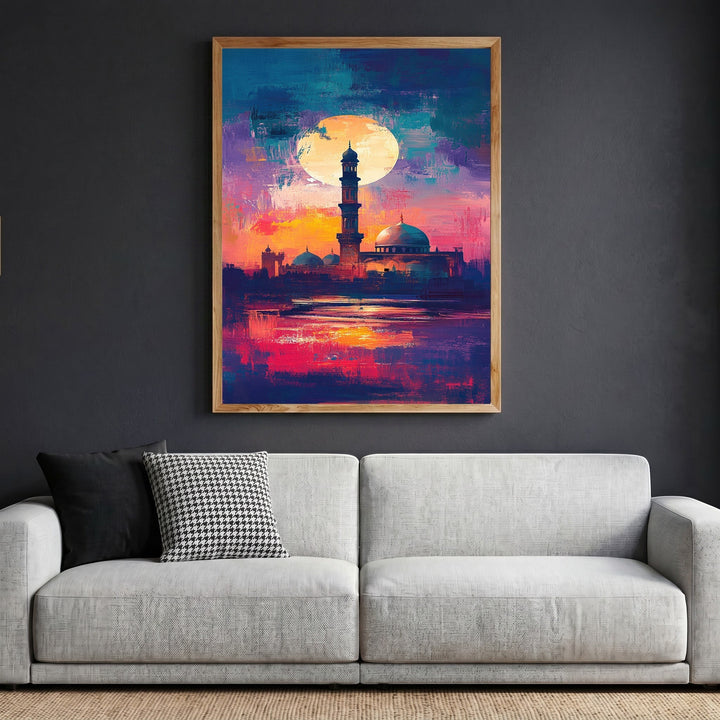 Wadi Home abstract mosque landscape wall art with vibrant sunset colors in a wooden frame above a modern grey sofa.