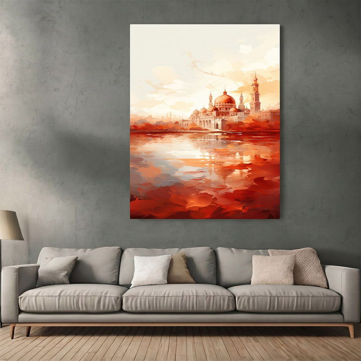 Wadi Home abstract mosque landscape wall art print with sunset orange and red tones hanging above a modern grey sofa.