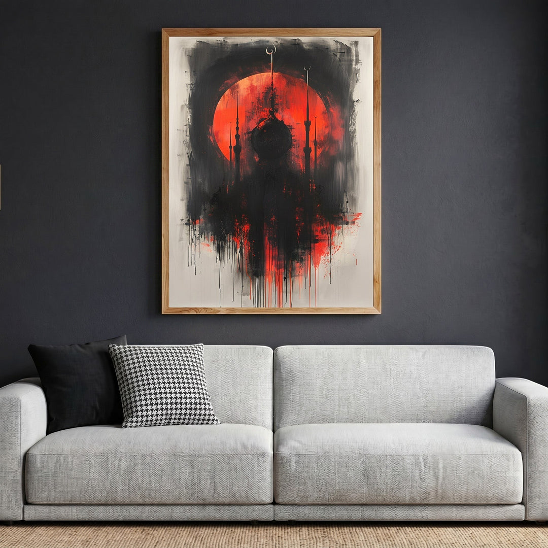 Wadi Home abstract mosque silhouette wall art with a fiery red sun and black brushstrokes in a wooden frame above sofa