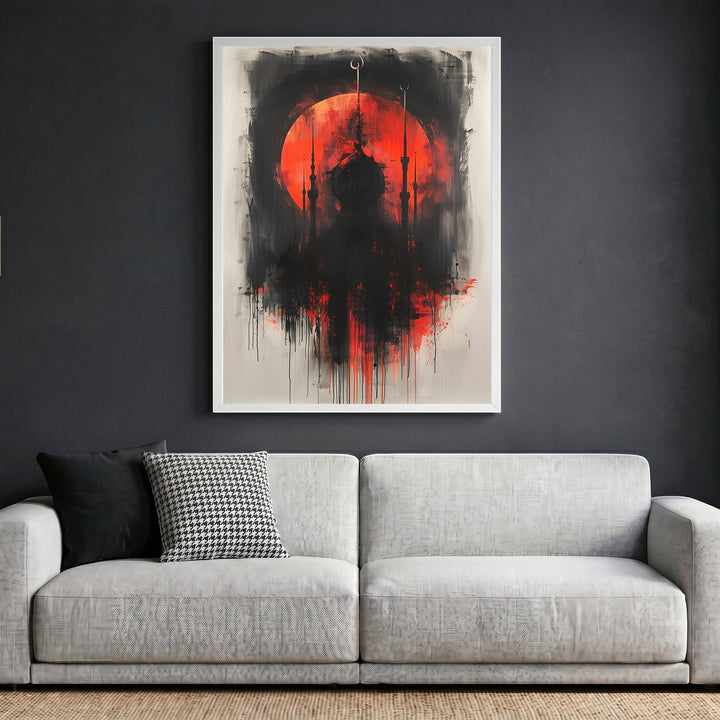 Wadi Home abstract mosque silhouette wall art with a red sun and black brushstrokes in a white frame above a sofa.