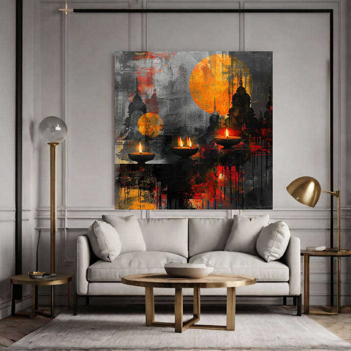 Wadi Home abstract canvas print featuring oil lamps and sunset tones above a modern sofa in a grey living room.