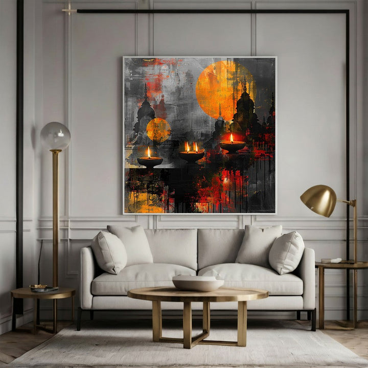 Wadi Home abstract canvas print featuring oil lamps, sunset orange, and charcoal tones above a modern grey sofa.