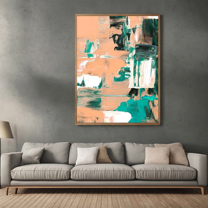 Wadi Home abstract expressionist canvas print with peach and forest green brushstrokes in a wooden frame above a sofa.
