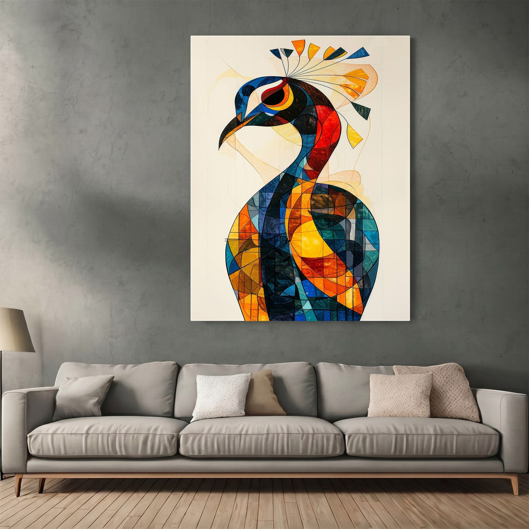 Wadi Home abstract geometric peacock wall art print with vibrant blue, orange, and yellow patterns above a grey sofa.