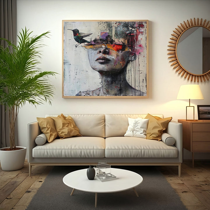 Wadi Home abstract portrait canvas print featuring a human silhouette and hummingbird above a modern beige sofa.