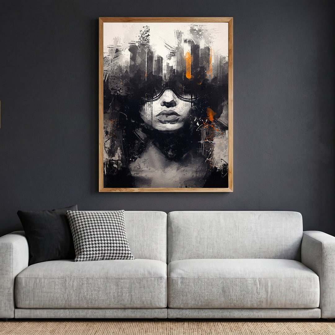 Wadi Home abstract portrait canvas print with black, white, and burnt orange brushstrokes in a wooden frame above a sofa.